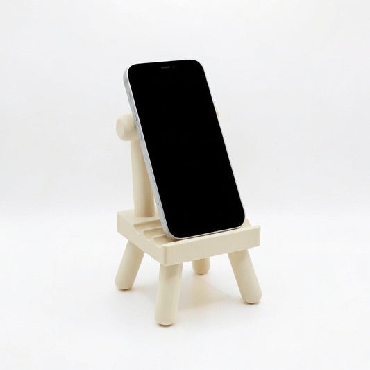 pooky stool phone stand holding a smartphone